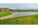 Community basketball court surrounded by green space and mountain views at 9305 S Gore St # C, Arvada, CO 80007