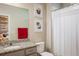 Well-lit bathroom featuring granite countertop and a coordinated color scheme and decor at 9305 S Gore St # C, Arvada, CO 80007