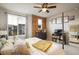 A modern bedroom featuring stylish decor, large windows, and ample natural light at 9305 S Gore St # C, Arvada, CO 80007