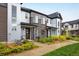 Stylish townhomes with modern design, low-maintenance landscaping, and welcoming front patios with seating at 9305 S Gore St # C, Arvada, CO 80007