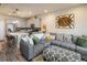Open-concept living area blending the kitchen and living room into one inviting space at 9305 S Gore St # C, Arvada, CO 80007