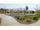 Community playground featuring swings, climbing structures, and a covered picnic area at 9305 S Gore St # C, Arvada, CO 80007