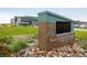 View of the Three Creeks K-8 School entrance with modern architecture and landscaping at 9305 S Gore St # C, Arvada, CO 80007
