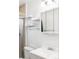 Clean bathroom with white vanity, mirrored medicine cabinet, and glass shower door at 3820 S Fraser St, Aurora, CO 80014