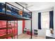 bedroom featuring a bunk bed, playful decor, and natural light at 3820 S Fraser St, Aurora, CO 80014