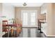 Dining area featuring a wooden table, chairs, and a view to the kitchen at 3820 S Fraser St, Aurora, CO 80014