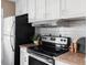 Kitchen with updated appliances, countertop space, and a minimalist design at 3820 S Fraser St, Aurora, CO 80014