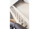Staircase with carpeted treads and white painted risers, creating a classic look at 3820 S Fraser St, Aurora, CO 80014