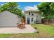 Quaint backyard featuring a brick patio, outdoor dining set, and a charming garden area at 4142 Chase St, Denver, CO 80212