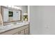 Bathroom with tile shower, marble countertop, and large mirror at 4142 Chase St, Denver, CO 80212