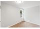 Clean, empty bedroom features neutral colors, updated carpet, and a window at 4142 Chase St, Denver, CO 80212