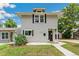 Charming two-story home with a well-manicured lawn and classic architectural details at 4142 Chase St, Denver, CO 80212