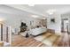 Spacious living room featuring modern decor, stylish furniture, and hardwood flooring at 4142 Chase St, Denver, CO 80212