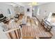 Open concept living room and dining room area with many windows and natural light at 4142 Chase St, Denver, CO 80212