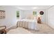 Bedroom features carpet, natural light, and a decorative throw blanket at 4142 Chase St, Denver, CO 80212