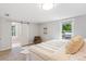 Bright bedroom features carpet, natural light, and a sliding door to a closet at 4142 Chase St, Denver, CO 80212