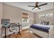 Functional bedroom set up as a combined living and work space with great natural light at 5108 S Pennsylvania St, Littleton, CO 80121