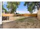 This expansive backyard features a wooden fence, a few trees, and plenty of space at 811 Plum N Ave, Lochbuie, CO 80603