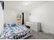 This cozy bedroom offers lots of sunlight, plush carpet and an adjacent dresser at 811 Plum N Ave, Lochbuie, CO 80603