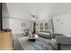 The staged living room has modern decor and a ceiling fan at 811 Plum N Ave, Lochbuie, CO 80603