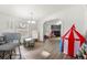 A play room with access to kitchen and living areas at 811 Plum N Ave, Lochbuie, CO 80603