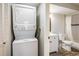 Updated bathroom with a stackable washer and dryer in closet at 8770 Corona St # 101, Denver, CO 80229