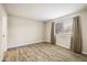 Spacious bedroom with a large window and new floors at 8770 Corona St # 101, Denver, CO 80229