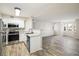 Bright kitchen features stainless steel appliances and granite countertops, flowing into a living area at 8770 Corona St # 101, Denver, CO 80229