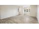 Bright living room with hardwood floors and multiple windows at 8770 Corona St # 101, Denver, CO 80229