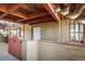 Private patio with a white door and a white-and-red fence at 8770 Corona St # 101, Denver, CO 80229