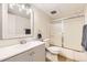 Bathroom featuring vanity with mirror and a shower with sliding glass door at 2160 S Vaughn Way # 104C, Aurora, CO 80014