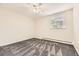 Carpeted bedroom featuring a ceiling fan, window and radiant heating at 2160 S Vaughn Way # 104C, Aurora, CO 80014