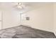 Carpeted bedroom featuring a ceiling fan, window and radiant heating at 2160 S Vaughn Way # 104C, Aurora, CO 80014