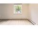 Bright bedroom featuring a window with outdoor views and light wood flooring at 2160 S Vaughn Way # 104C, Aurora, CO 80014