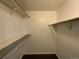 Walk-in closet with custom shelving perfect for storage at 2160 S Vaughn Way # 104C, Aurora, CO 80014