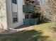 View of the exterior with a patio and green lawn at 2160 S Vaughn Way # 104C, Aurora, CO 80014