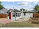 Charming backyard with garden beds, patio, and a cozy exterior at 1301 Kenton St, Aurora, CO 80010
