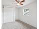 Bedroom with a ceiling fan, a closet, carpet, and natural light at 1301 Kenton St, Aurora, CO 80010