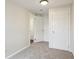 Bedroom featuring neutral carpet and multiple white doors at 1301 Kenton St, Aurora, CO 80010