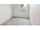 Bedroom with neutral carpet, natural light, and minimalist decor at 1301 Kenton St, Aurora, CO 80010