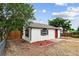 Exterior view of a charming home with tidy landscaping and a classic style at 1301 Kenton St, Aurora, CO 80010