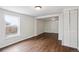Bright and airy living space with wood floors, large window, and closet at 1301 Kenton St, Aurora, CO 80010