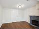Cozy living room featuring an electric fireplace and wood flooring at 1301 Kenton St, Aurora, CO 80010
