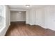 Open living space with wood floors, neutral walls, and lots of natural light at 1301 Kenton St, Aurora, CO 80010
