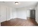 Spacious living area with wood floors, neutral paint, and ample lighting at 1301 Kenton St, Aurora, CO 80010