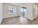 A bright living room has a sliding glass door that opens to the outdoor living space at 576 Nightsky St, Erie, CO 80516