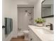 Modern bathroom with quartz countertop, sleek fixtures, subway tile shower, and updated vanity at 625 S Alton Way # 3A, Denver, CO 80247