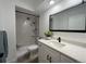 Updated bathroom features a walk-in shower with new fixtures, a modern vanity, and contemporary design at 625 S Alton Way # 3A, Denver, CO 80247