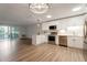 Open-concept kitchen boasts stainless steel appliances, white cabinets, and access to a private balcony at 625 S Alton Way # 3A, Denver, CO 80247