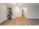 Bright and airy living room showcases laminate flooring, complemented by a modern chandelier and closet doors at 625 S Alton Way # 3A, Denver, CO 80247